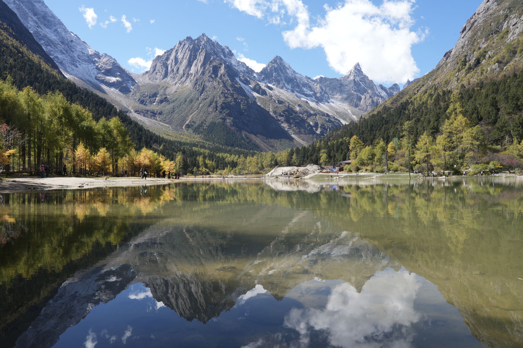 Bipeng Valley mirror lake reflecting snow peaks at autumn — hero image for the Changping–Bipeng Traverse trek by Boutique China