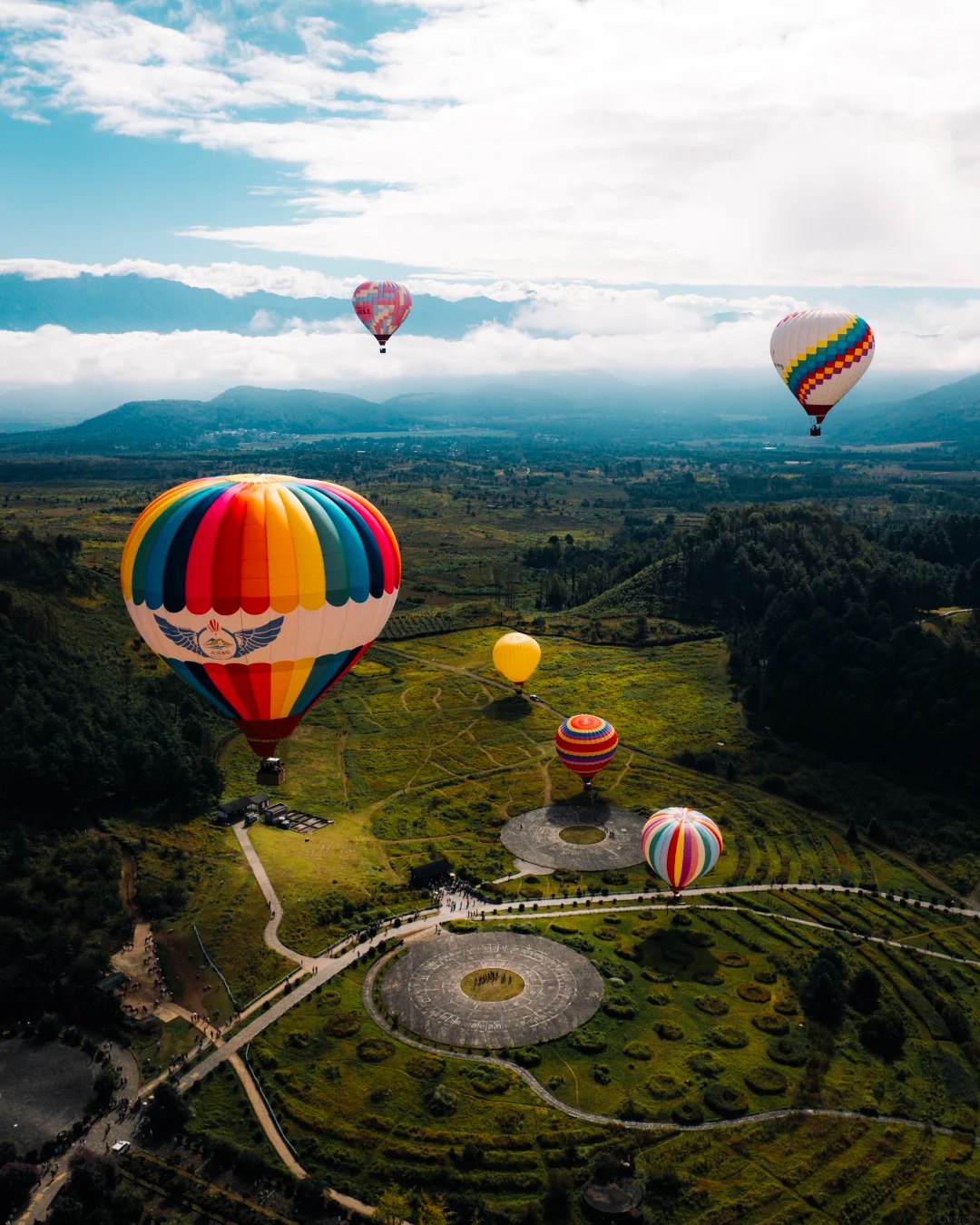 Hot-air balloons rising over Tengchong's dormant volcanic craters at sunrise — hero image for the Tengchong Family Adventure by Boutique China